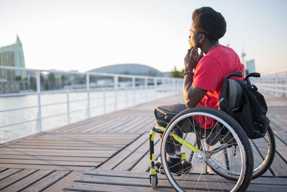 Man in wheelchair on boardwalk