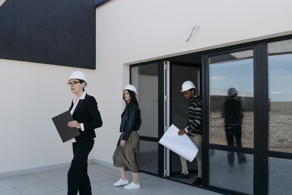 inspectors leaving a building