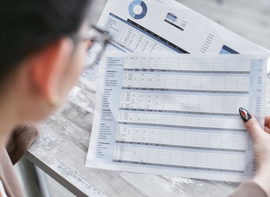 person reviewing printouts of data