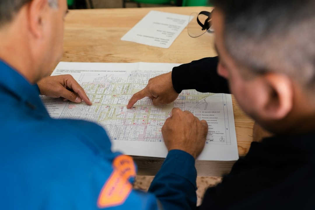 two people reviewing a plan