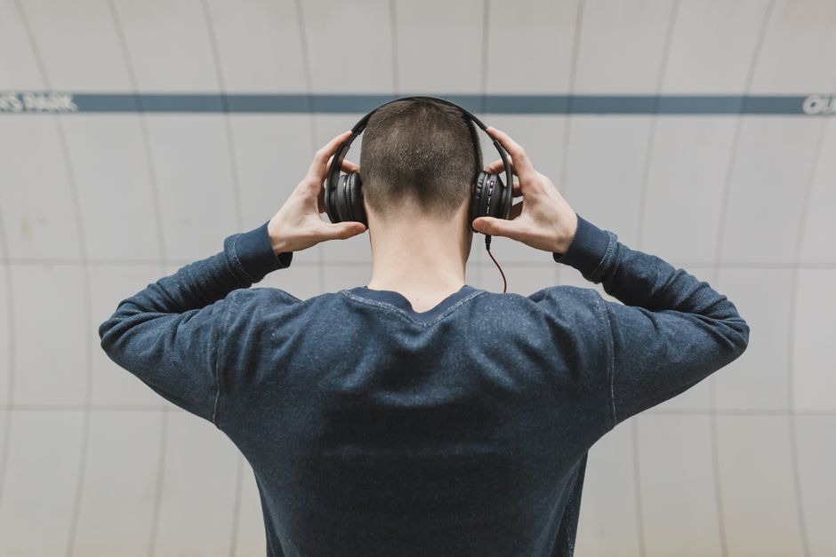man wearing assistive hearing headphones