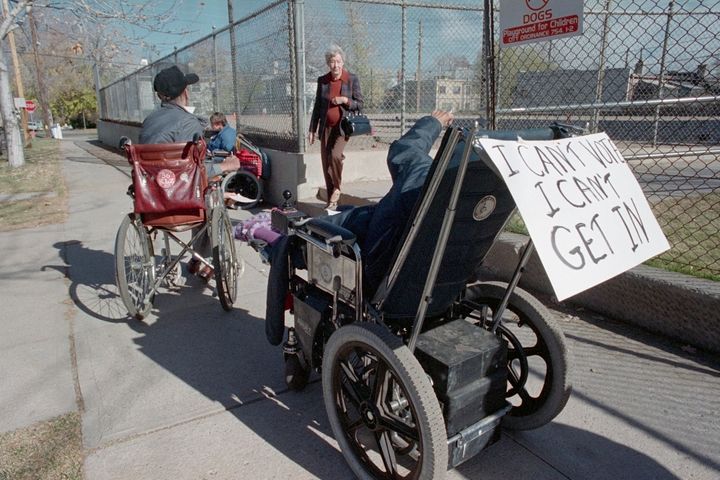 Image of man in wheelchair unable to enter polling place with no ramp