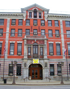 Image of Dutches County Courthouse, brick building with grey moldings and trim