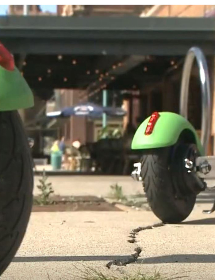 Image of electric scooters on sidewalk